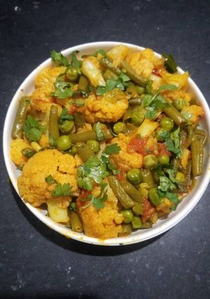 A picture of Cauliflower French Beans and Green Peas Curry.