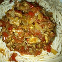 A picture of White spaghetti with meat sauce.