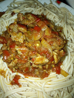 A picture of White spaghetti with meat sauce.