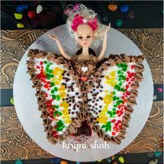 A picture of Butterfly doll cake.