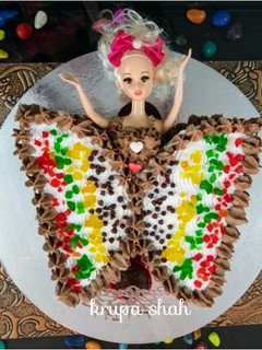 A picture of Butterfly doll cake.