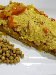 Una foto de Filet de merluza al curry!.