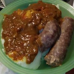 A picture of Pap, gravy and boerewors.