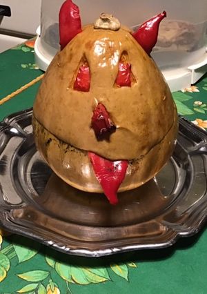 Une photo de Diable de courge sucrine farcie morue,poivron,oignon au bouillon de curry