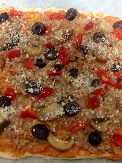 Una foto de Pizza sin gluten con atún a tu gusto