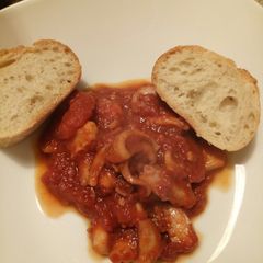 A picture of Octopus in a spicy tomato sauce.