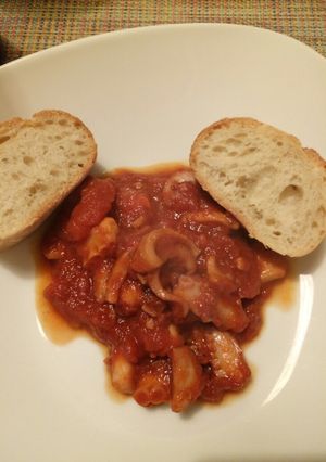 A picture of Octopus in a spicy tomato sauce.