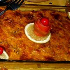 A picture of Baked chicken cheese pasta with orange sauce.