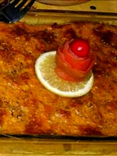 A picture of Baked chicken cheese pasta with orange sauce.