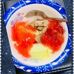 A picture of Ice cream topped with jelly dessert.