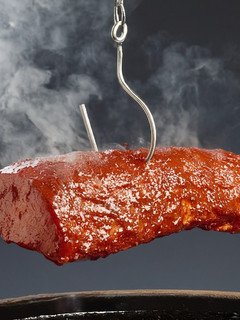 Una foto de Bondiola en salsa BBQ