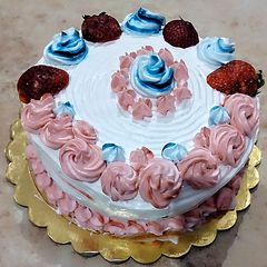 A picture of Eggless Wheat Butterscotch cake with whipped cream.