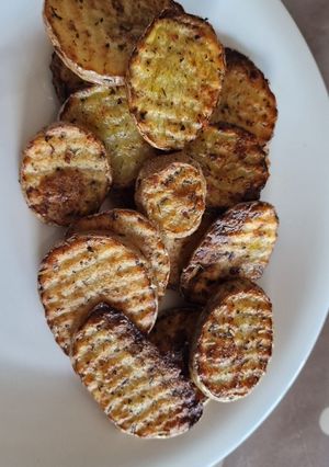 Una foto de Patatas onduladas al horno- toque italiano
