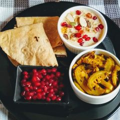 A picture of Muesli, Vermicelli Kheer, Kantola Aloo Fry And Roti.