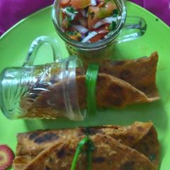 A picture of Carrot paratha with salsa fillings.