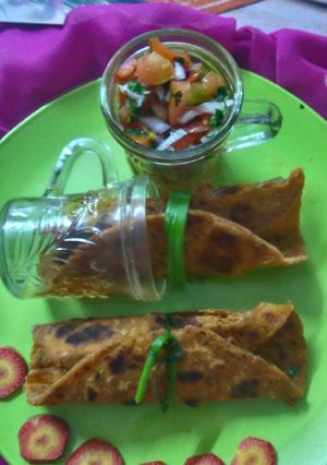 A picture of Carrot paratha with salsa fillings.