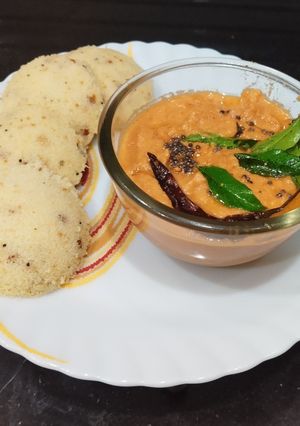 A picture of Rava Idli with Tomato Chutney.