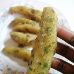 A picture of Deep fried potato wedges.
