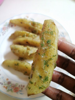 A picture of Deep fried potato wedges.