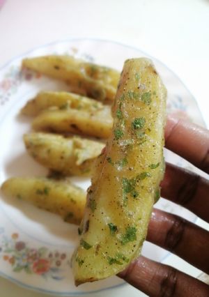 A picture of Deep fried potato wedges.