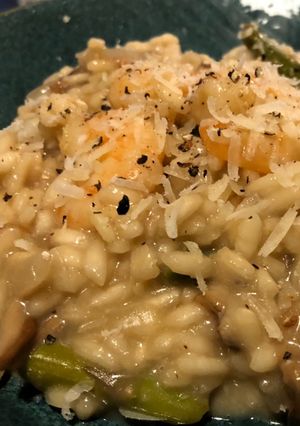 A picture of King Prawn, asparagus, and porcini mushroom risotto.