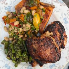A picture of Roasted Chicken Thighs with Sweet Potato and Bean Salad.