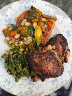 A picture of Roasted Chicken Thighs with Sweet Potato and Bean Salad.