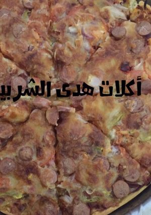 صورة لوصفة بيتزا بالعجينه الرقيقه