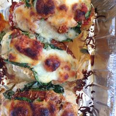 A picture of Stuffed spinach and cheese chicken breast.