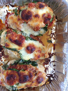 A picture of Stuffed spinach and cheese chicken breast.