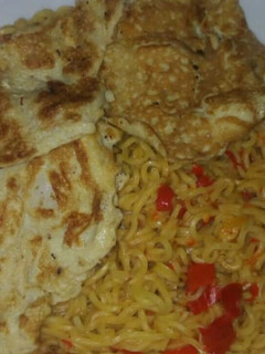 A picture of Indomie with fried egg.