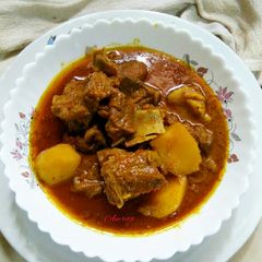A picture of Mutton Curry with spicy gravy.