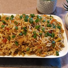 A picture of Schezwan egg fried rice.
