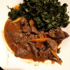 A picture of Liver served with spinach.