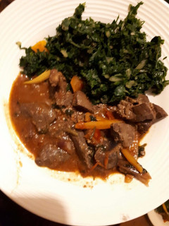 A picture of Liver served with spinach.