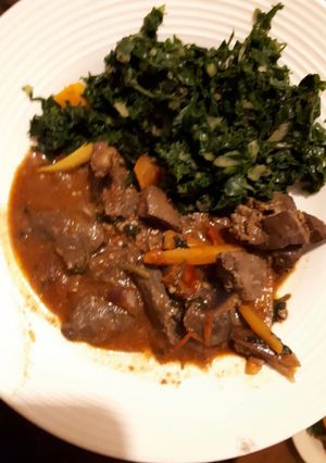 A picture of Liver served with spinach.