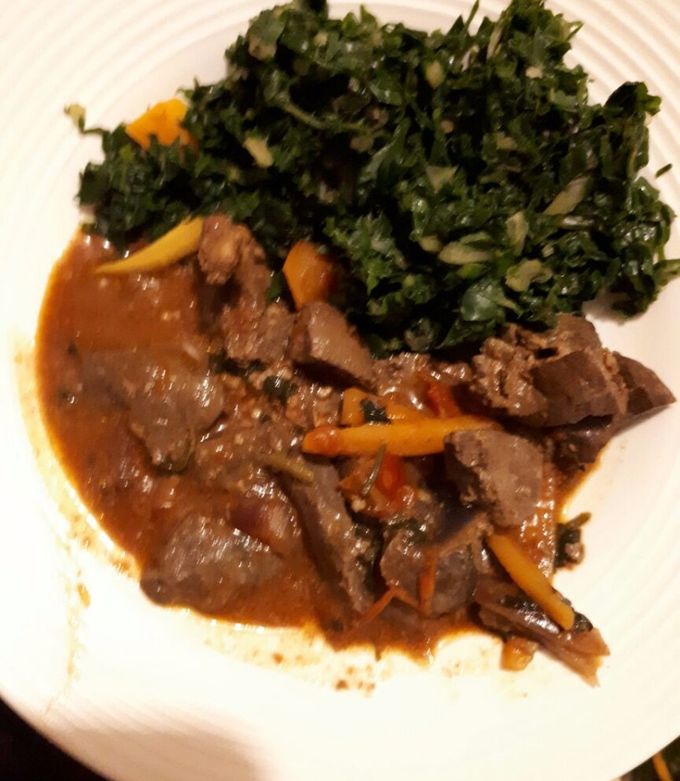 A picture of Liver served with spinach.