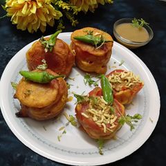 A picture of Chicken Keema Stuffed Tomato Bonda - Durga Puja special Snack Recipe.