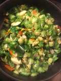 Fried brussel sprouts with carrots and zucchini