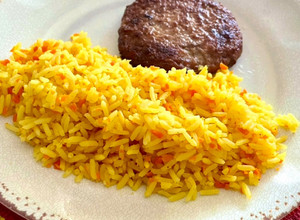 Una foto de Arroz graneado con zanahoria y naranja 🍊