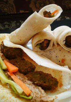 A picture of Dosa wrap with falafel.