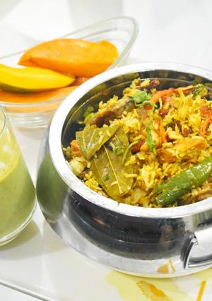 A picture of Kathal biryani with pudina dhania chhachh.