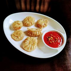 A picture of Veg Momos (with beetroot stuffing).