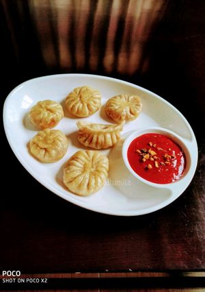 A picture of Veg Momos (with beetroot stuffing).