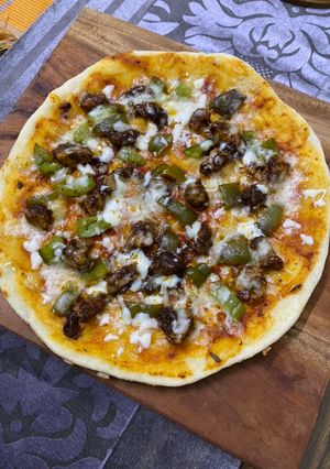 A picture of Thin crust chicken shrimp pizza (stovetop).