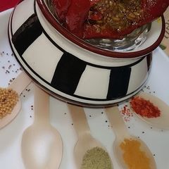 A picture of Stuffed red chilli pickle.