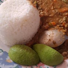 Rice served with green grams and Ovacado A picture of Rice served with green grams and Ovacado.