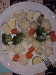 Una foto de Verduras con mantequilla y parmesano