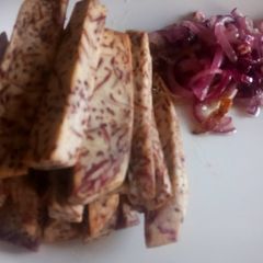 A picture of Oven roasted crispy arrow root sticks with buttered onions.