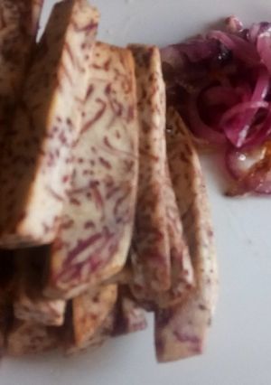 A picture of Oven roasted crispy arrow root sticks with buttered onions.